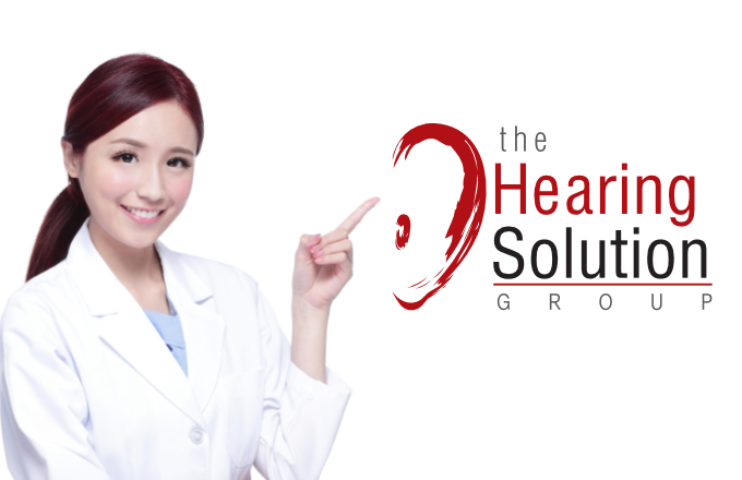 Smiling medical doctor woman show something. Isolated over white background. asian